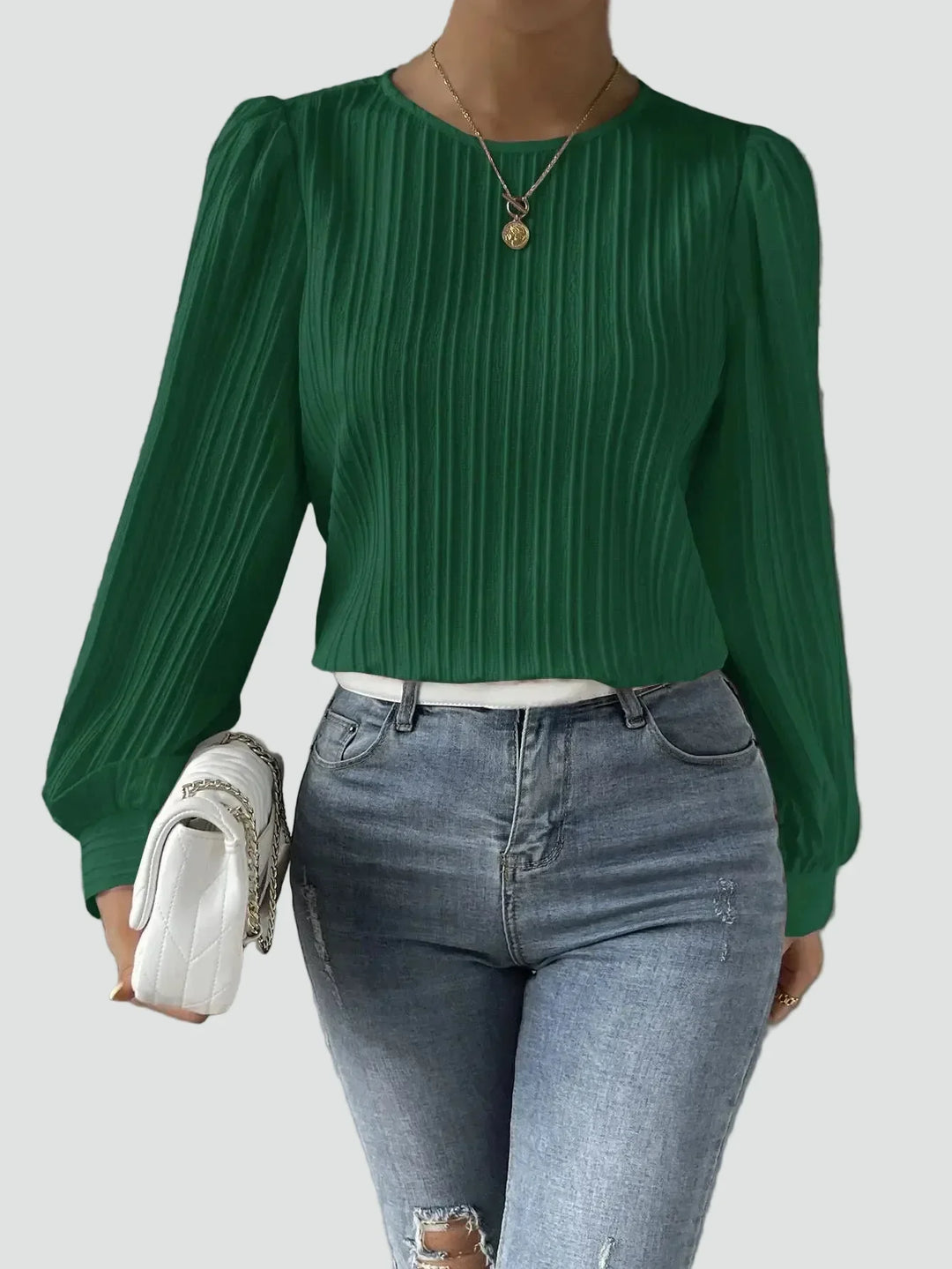 Elegant women's blouse with pleated fabric and puff sleeves