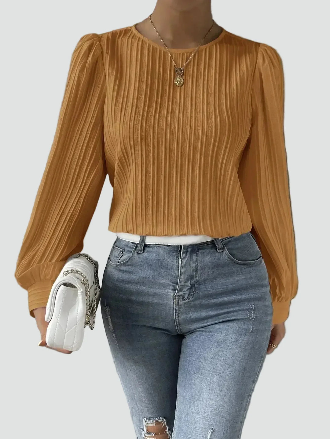 Elegant women's blouse with pleated fabric and puff sleeves