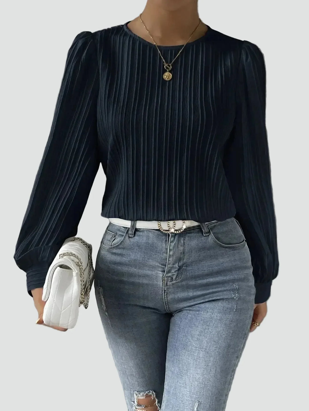 Elegant women's blouse with pleated fabric and puff sleeves