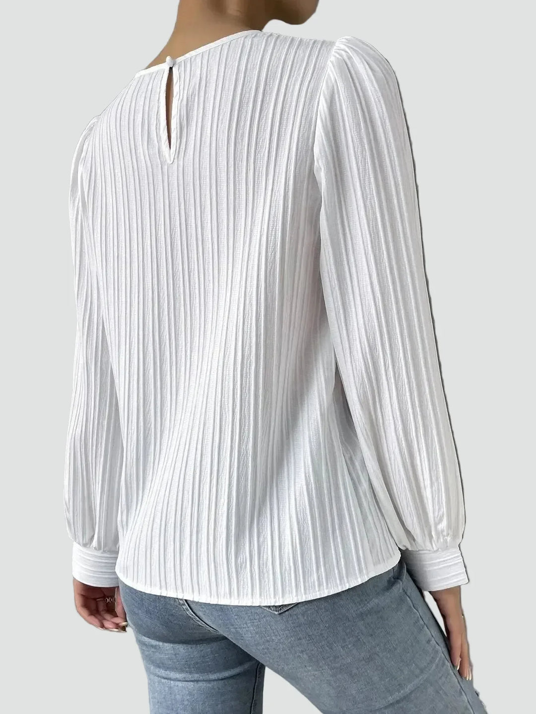 Elegant women's blouse with pleated fabric and puff sleeves