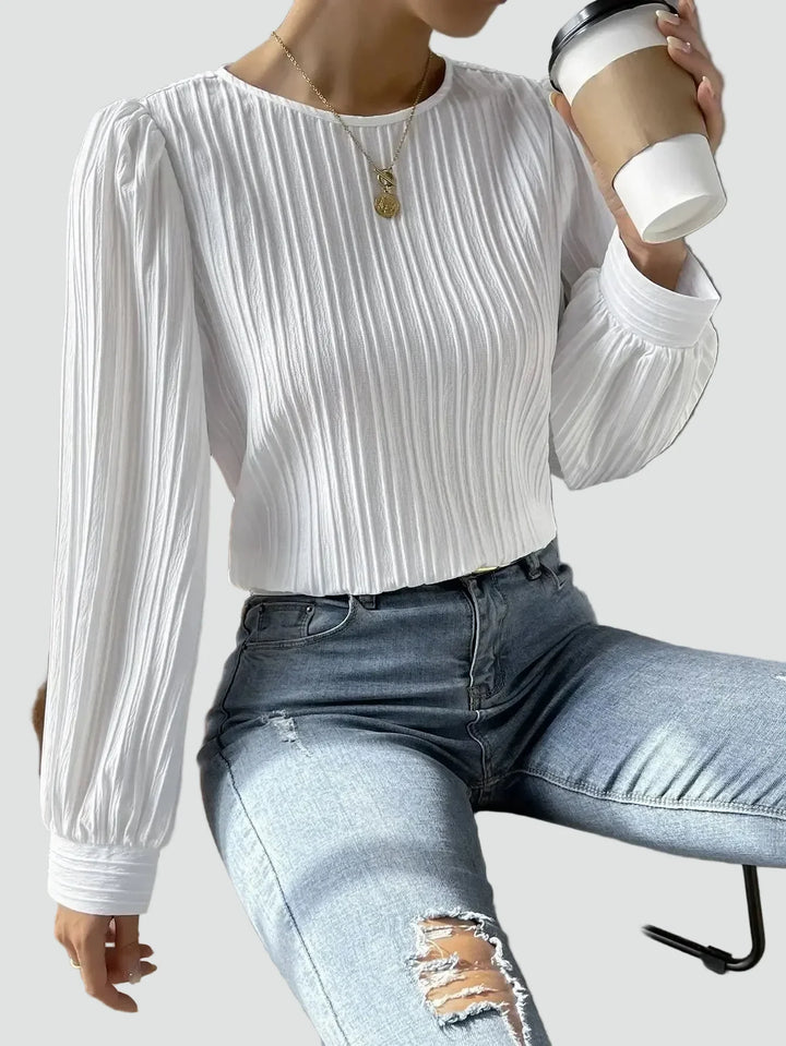 Elegant women's blouse with pleated fabric and puff sleeves