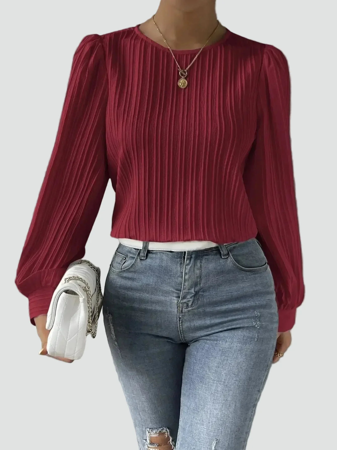 Elegant women's blouse with pleated fabric and puff sleeves